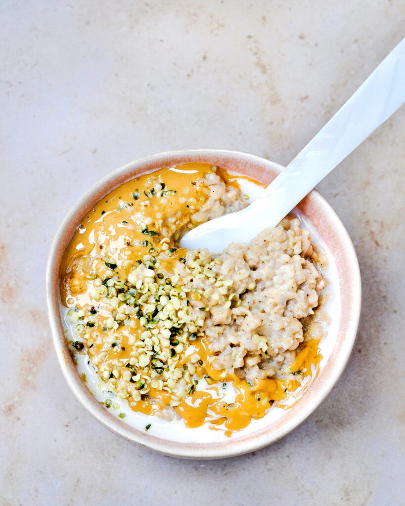 Breakfast oatmeal garnished with hemp seeds, illustrating dietary integration